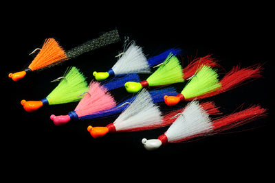 collection of pea hawk jigs in assorted colors, gulfstream lures, peacock bass lure, peacock bass jig, mangrove snapper lure, mangrove snapper jig, redfish lure, redfish jig, casting jig