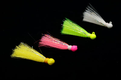 Collection of Yellow Tail Jigs in various colors. This Gulfstream Lure with a bell-shaped head, nylon skirt and flashy Mylar strips make the Yellowtail Jig irresistible. It is the best yellow tail jig and also great when used as Pompano Jig, Spanish Mackerel lure, Jack lure. Saltwater casting jigs, saltwater casting lure.