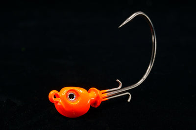 Orange Pro Skimmer Jig Head with 3D eyes and patented no fail bait keeper. Jig Head for soft tails, saltwater lures, gulfstream lures, best snook jig head, best seatrout jig head, best redfish jig head, best flounder jig head, best triple tail jig head, casting jigs, jig head for soft plastic